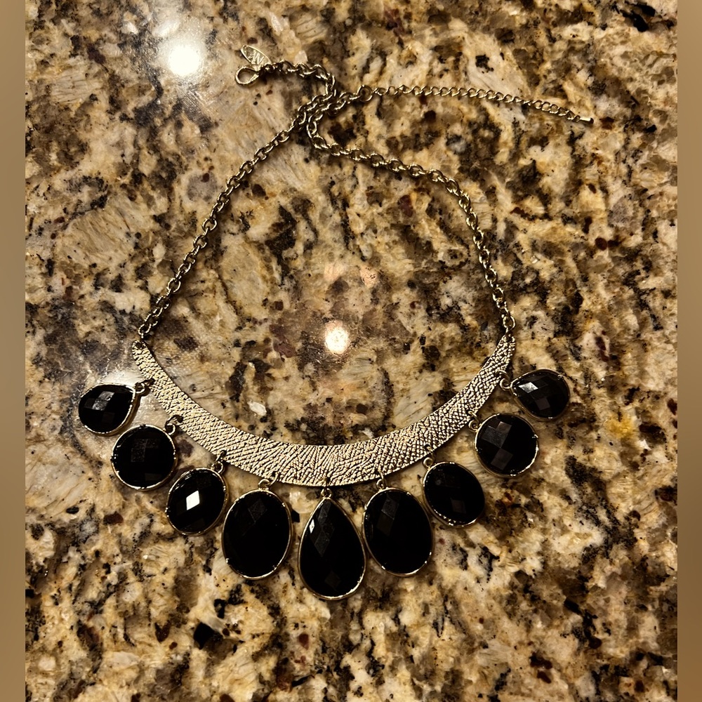 Gold necklaces with black jewels